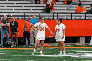 Emma Ward and Emma Tyrrell combined to score 10 goals as No. 5 Syracuse defeated No. 7 Loyola 16-13 for its fifth straight win.